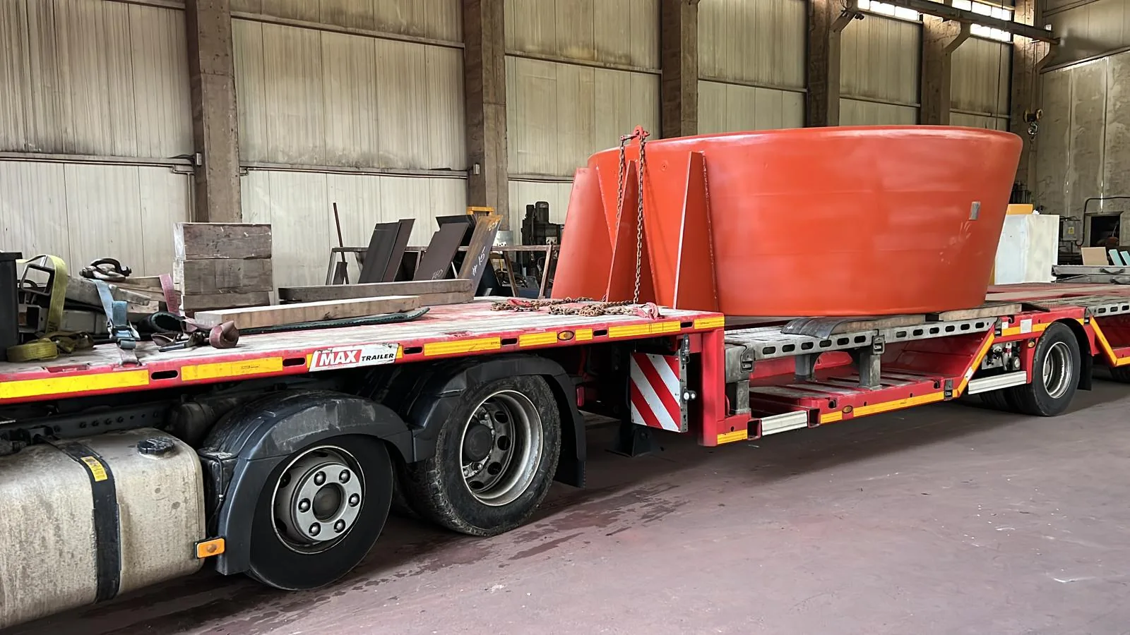Large fabricated marine component on low-loader trailer